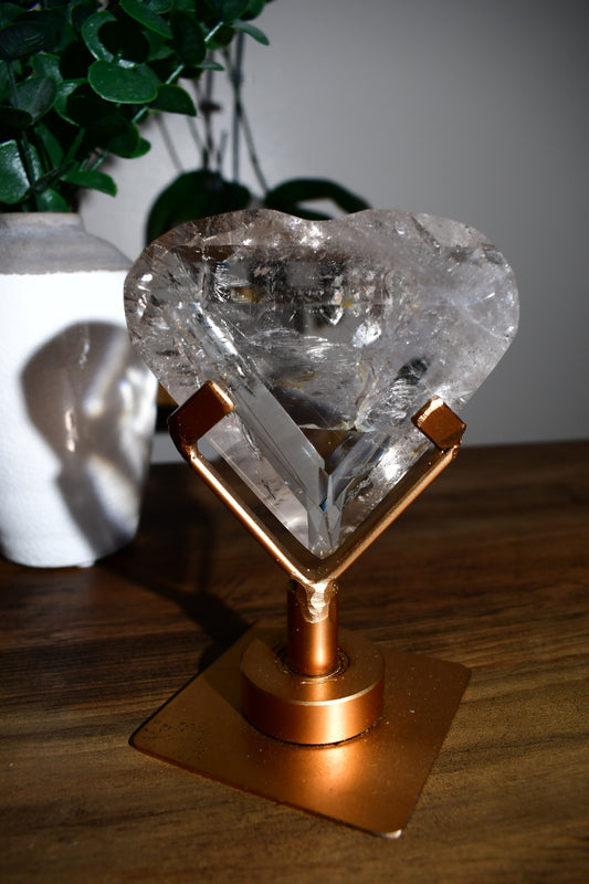 Lemurian Heart Carving with Rutile on Spinning Stand