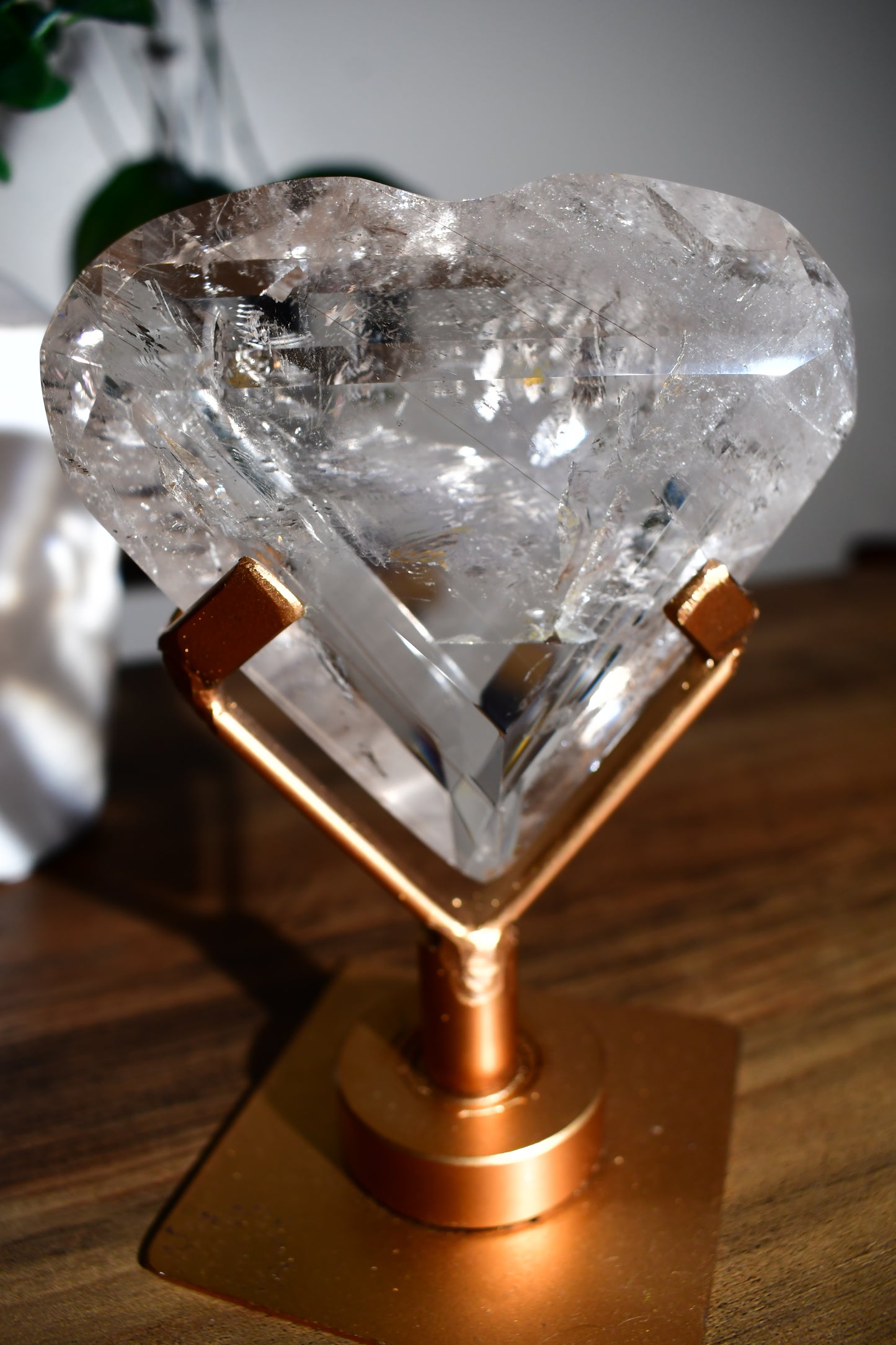 Lemurian Heart Carving with Rutile on Spinning Stand